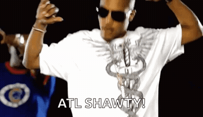 A Man Wearing Sunglasses And A White Shirt With The Word Atl Shawty On It . GIF