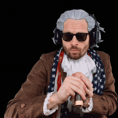 A Man Wearing Sunglasses And A Wig Is Holding A Cane GIF