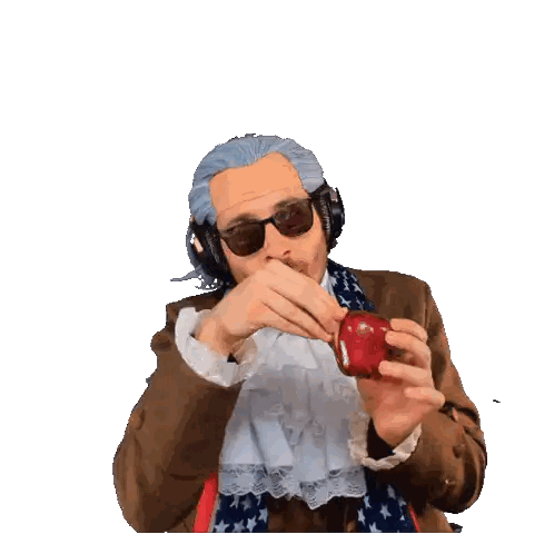 A Man Wearing Sunglasses And A Wig Is Holding An Apple GIF