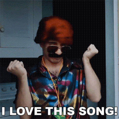 A Man Wearing Sunglasses And A Wig Says " I Love This Song " GIF