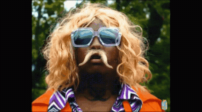 A Man Wearing Sunglasses And A Wig With A Mustache GIF