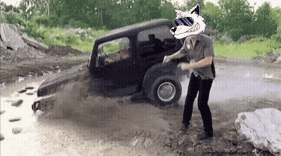 A Man Wearing Sunglasses And A Wolf Head Is Standing In Front Of A Jeep GIF