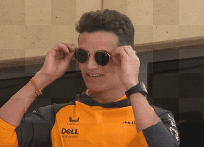 A Man Wearing Sunglasses And An Orange Shirt That Says Dell GIF