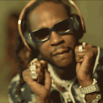 A Man Wearing Sunglasses And Headphones Has A Watch On His Left Wrist GIF