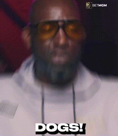A Man Wearing Sunglasses And Headphones Is Saying Dogs ! GIF