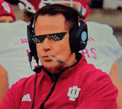 A Man Wearing Sunglasses And Headphones Is Wearing A Red Adidas Jacket GIF