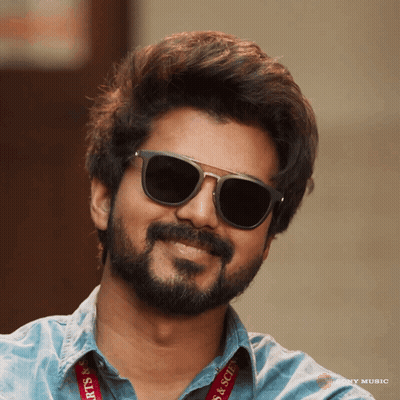 A Man Wearing Sunglasses Has A Lanyard That Says Arts & Science On It GIF