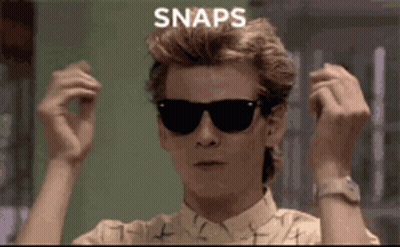 A Man Wearing Sunglasses Has The Word Snaps Written On His Head GIF