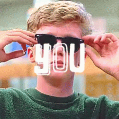 A Man Wearing Sunglasses Has The Word You Written In White On His Face GIF