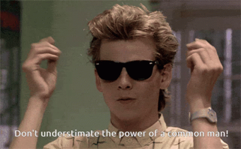 A Man Wearing Sunglasses Has The Words " Don 'T Underestimate The Power Of A Common Man " Below Him GIF