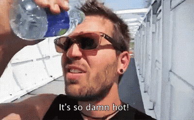 A Man Wearing Sunglasses Is Drinking Water From A Bottle And Says It 'S So Damn Hot . GIF
