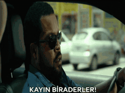 A Man Wearing Sunglasses Is Driving A Car And Says Kayin Biraderler ! GIF