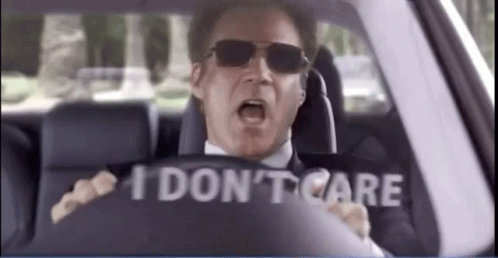 A Man Wearing Sunglasses Is Driving A Car With A Sign That Says `` I Don 'T Care '' . GIF