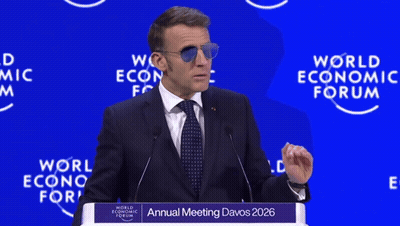 A Man Wearing Sunglasses Is Giving A Speech At The Annual Meeting Of The World Economic Forum GIF