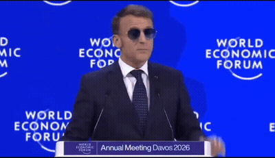A Man Wearing Sunglasses Is Giving A Speech At The Annual Meeting Of The World Economic Forum GIF