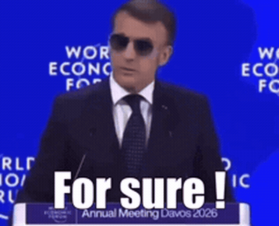 A Man Wearing Sunglasses Is Giving A Speech At The World Economic Forum Annual Meeting GIF