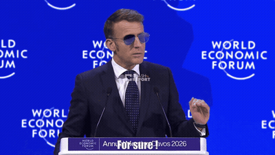 A Man Wearing Sunglasses Is Giving A Speech At The World Economic Forum In 2026 GIF