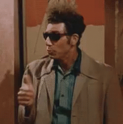 A Man Wearing Sunglasses Is Giving A Thumbs Up . GIF
