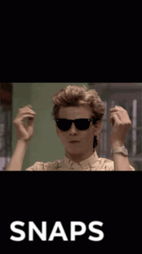 A Man Wearing Sunglasses Is Giving The Middle Finger And The Word Snaps Is On The Bottom GIF