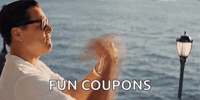 A Man Wearing Sunglasses Is Holding A Cell Phone In Front Of The Ocean And The Words Fun Coupons Are Above Him . GIF