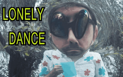 A Man Wearing Sunglasses Is Holding A Piece Of Paper With The Words Lonely Dance Written Above Him GIF