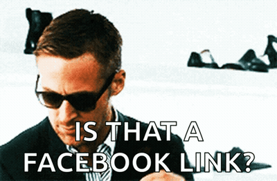 A Man Wearing Sunglasses Is Looking At His Phone With The Words Is That A Facebook Link Below Him GIF