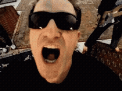 A Man Wearing Sunglasses Is Making A Funny Face With His Mouth Wide Open . GIF