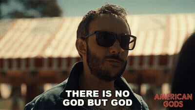 A Man Wearing Sunglasses Is Saying There Is No God But God GIF