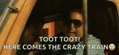 A Man Wearing Sunglasses Is Screaming Out Of A Car Window And Says Toot Toot Here Comes The Crazy Train . GIF