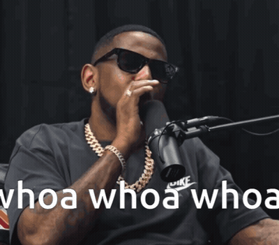 A Man Wearing Sunglasses Is Singing Into A Microphone With The Words Whoa Whoa Whoa GIF