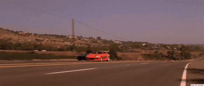 A Man Wearing Sunglasses Is Sitting In A Car With A Can Of Soda In His Hand GIF