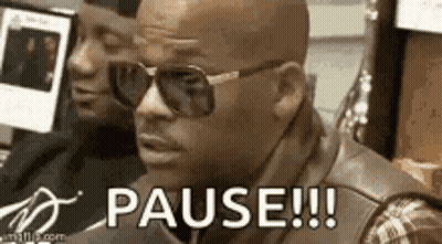 A Man Wearing Sunglasses Is Sitting In Front Of A Computer And Says `` Pause !!! '' . GIF