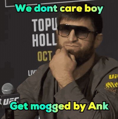 A Man Wearing Sunglasses Is Sitting In Front Of A Microphone And Says We Dont Care Boy Get Mogged By Ank GIF