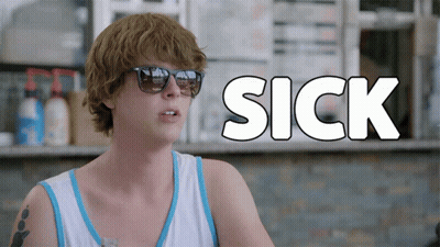 A Man Wearing Sunglasses Is Sitting In Front Of A Sign That Says " Sick " GIF