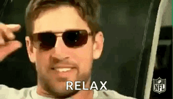 A Man Wearing Sunglasses Is Smiling And Making A Peace Sign With His Hand . GIF