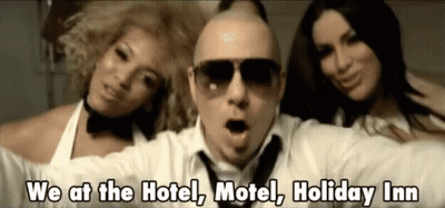 A Man Wearing Sunglasses Is Surrounded By Two Women And The Words We At The Hotel Motel Holiday Inn GIF