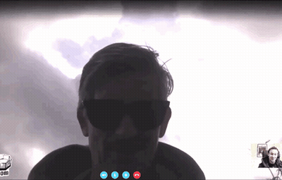 A Man Wearing Sunglasses Is Talking On A Video Call GIF