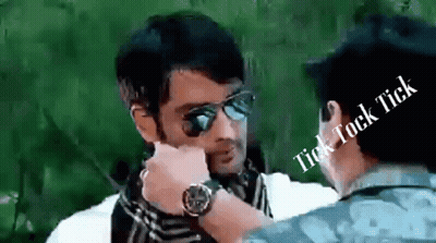 A Man Wearing Sunglasses Is Talking To Another Man With The Words Tick Tock Tick Above Him GIF