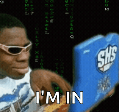 A Man Wearing Sunglasses Is Typing On A Shs Computer GIF