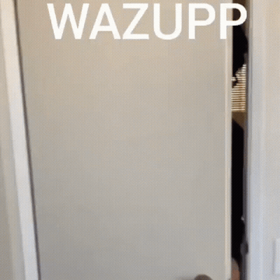 A Man Wearing Sunglasses Peeking Out From Behind A Door With The Word Wazupp Above Him GIF
