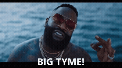 A Man Wearing Sunglasses Says " Big Tyme " In Front Of The Ocean GIF