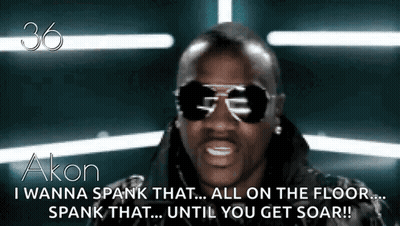 A Man Wearing Sunglasses Says " I Wanna Spank That All On The Floor Spank That ... Until You Get Soar !! " GIF