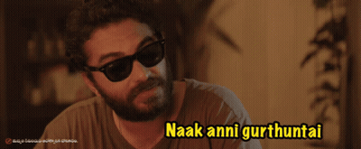 A Man Wearing Sunglasses Says Naak Anni Gurthuntai In Yellow Letters GIF
