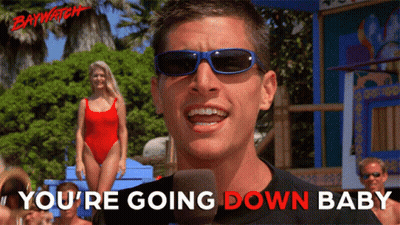 A Man Wearing Sunglasses Says " You 'Re Going Down Baby " In Front Of A Microphone GIF