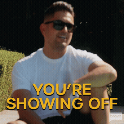 A Man Wearing Sunglasses Says You 'Re Showing Off In Yellow Letters GIF