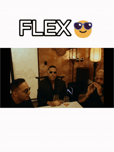 A Man Wearing Sunglasses Sits At A Table With Two Other Men With The Word Flex Above Him GIF