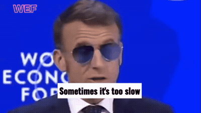 A Man Wearing Sunglasses Stands In Front Of A Blue Background That Says Work Econo For And Need To Be Reformed GIF