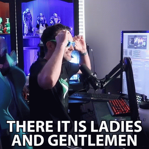 A Man Wearing Sunglasses Stands In Front Of A Microphone With The Words There It Is Ladies And Gentlemen Above Him GIF