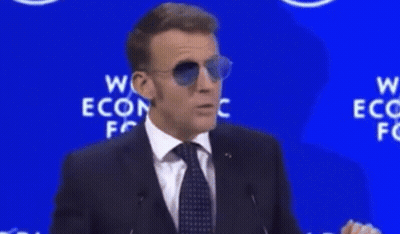 A Man Wearing Sunglasses Stands In Front Of A Sign That Says " For Sure " GIF