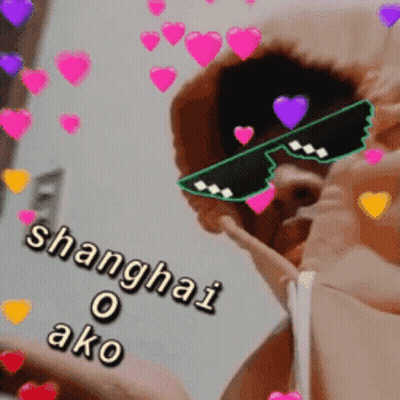 A Man Wearing Sunglasses That Say Shanghai O Ako Is Surrounded By Hearts GIF